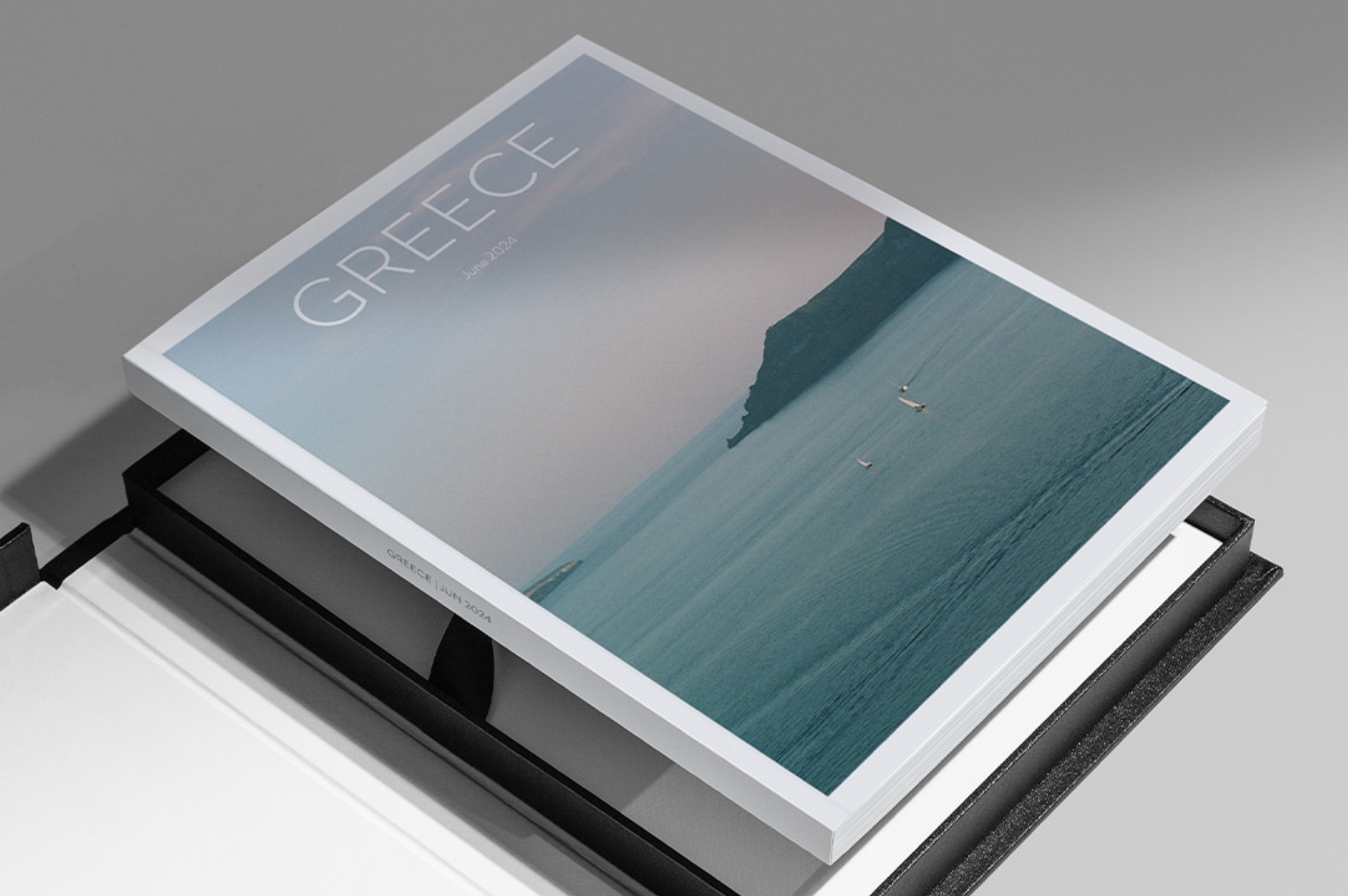 Black presentation box with travel magazine inside fitting perfectly.