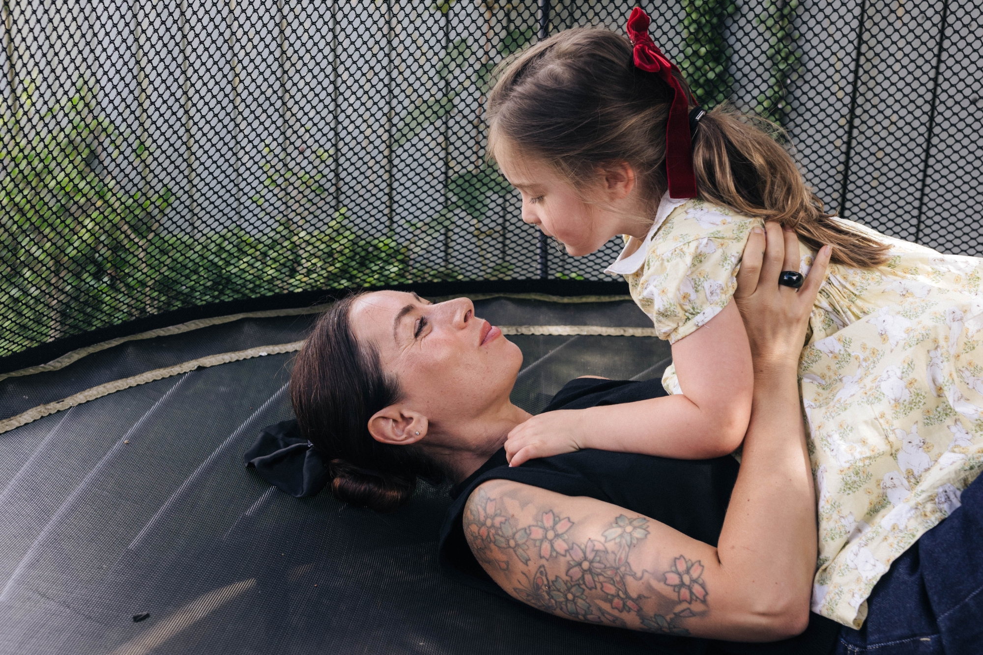 Mum and daughter on trampoline