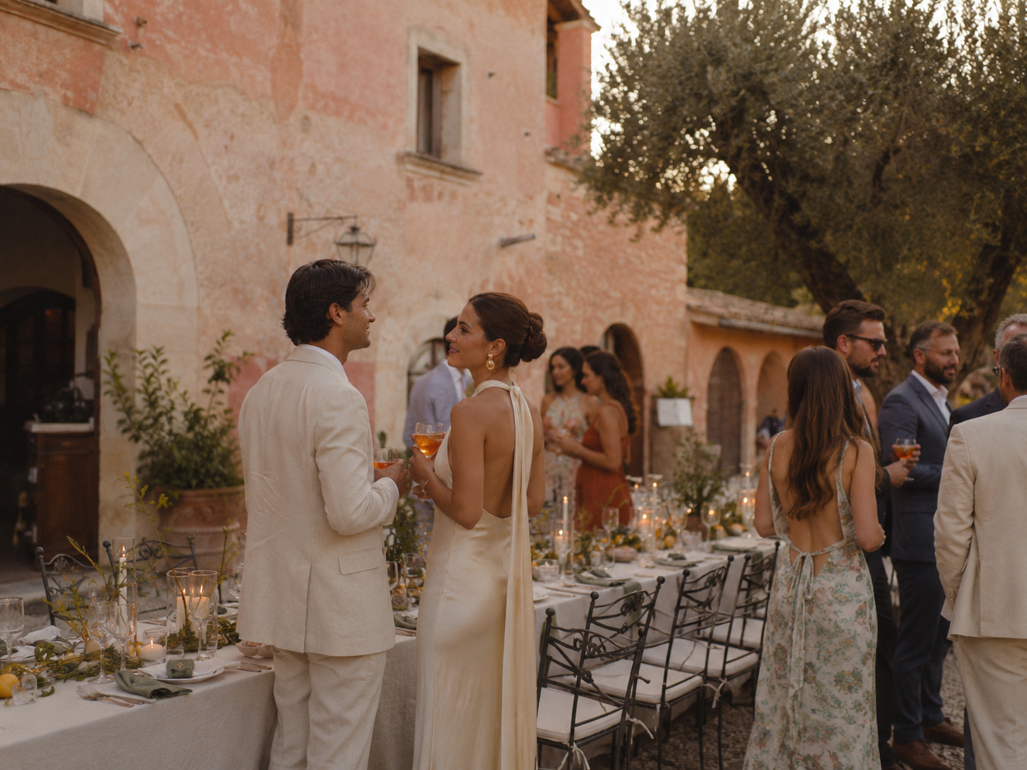 Couple at a modern, outdoor rehearsal dinner with guests