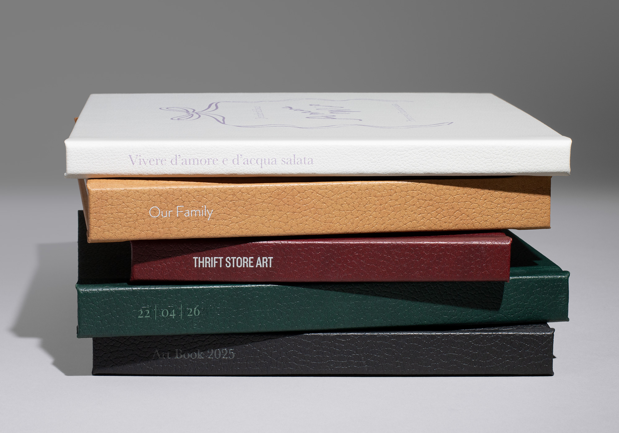 Stack of vegan leather premium photo books