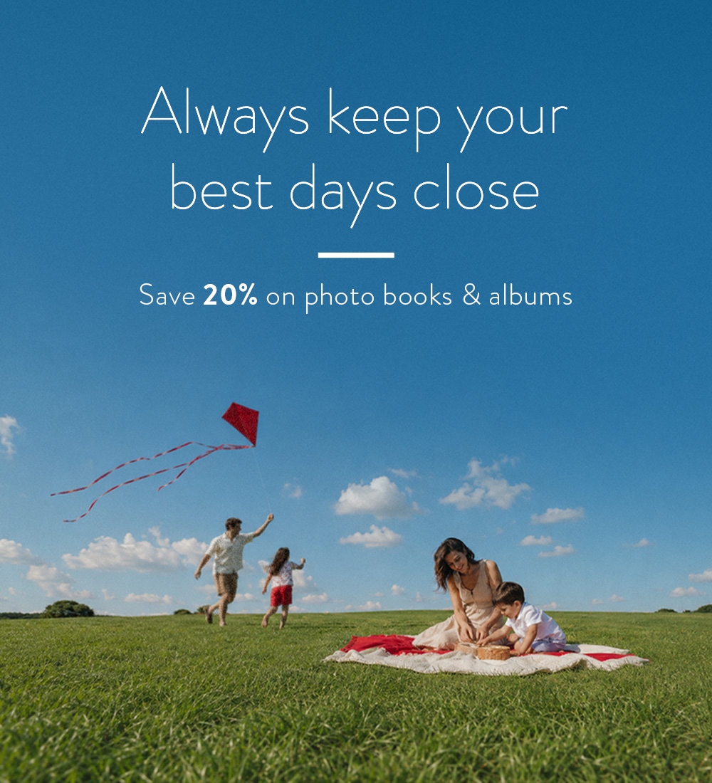 A family playing on a field - save 20% with Family Photo Week