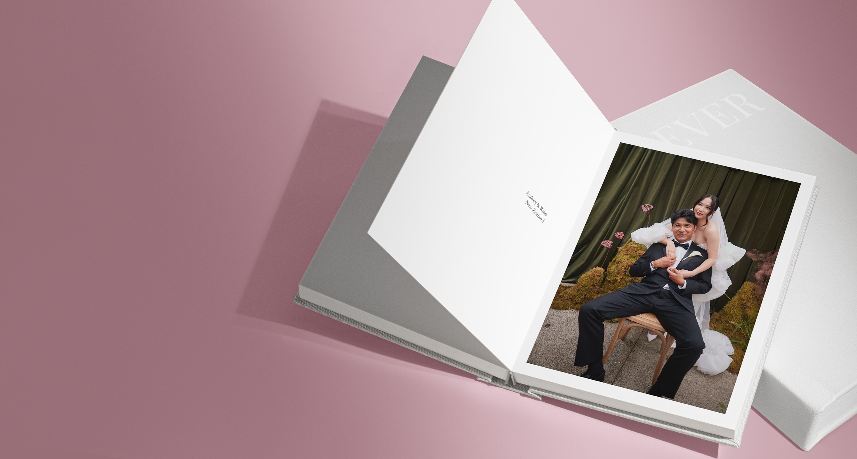 Couple getting married image on a photo book with a pink background