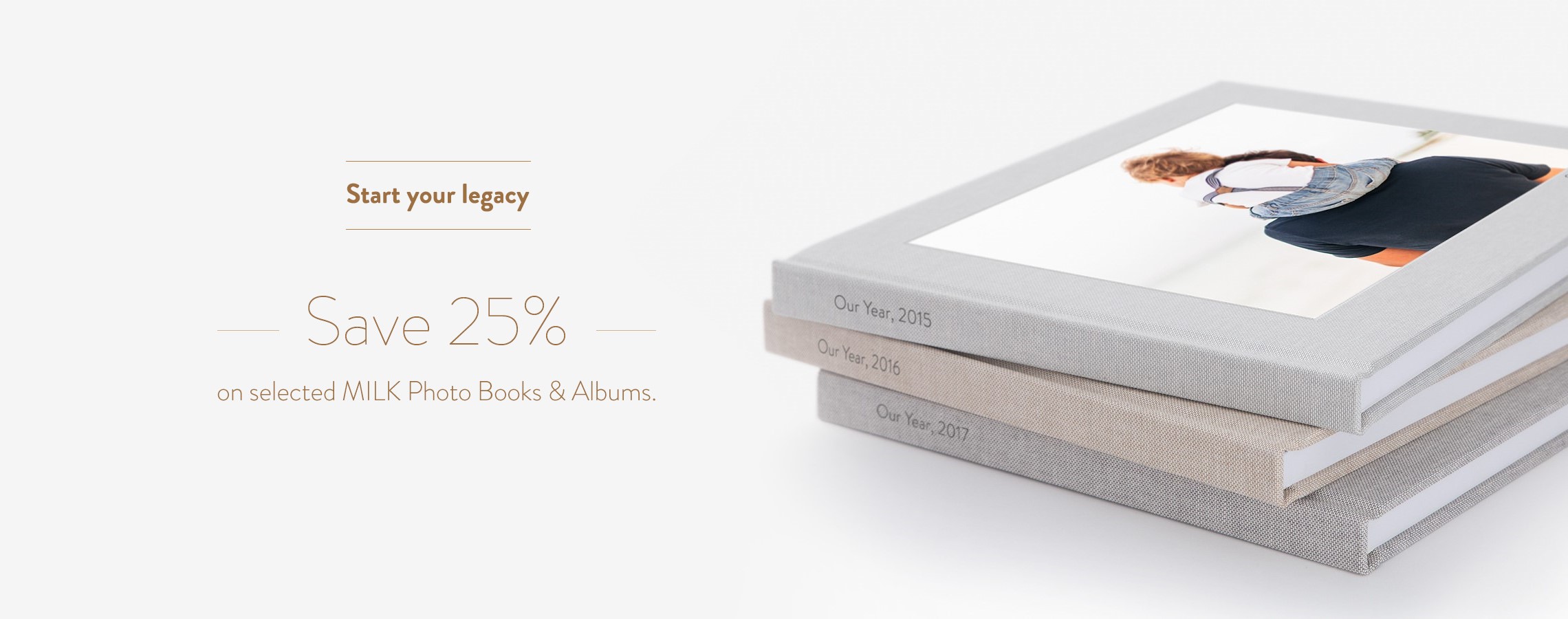 Stack of natural linen MILK Photo Books.