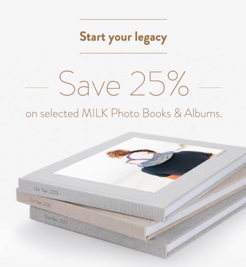 Stack of natural linen MILK Photo Books.